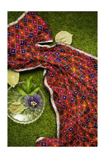 Rangoli Charm Phulkari reflects the vibrant magenta base and multicolor embroidery, reminiscent of a traditional rangoli design, full of color and cultural richness. - The Amritsar Store