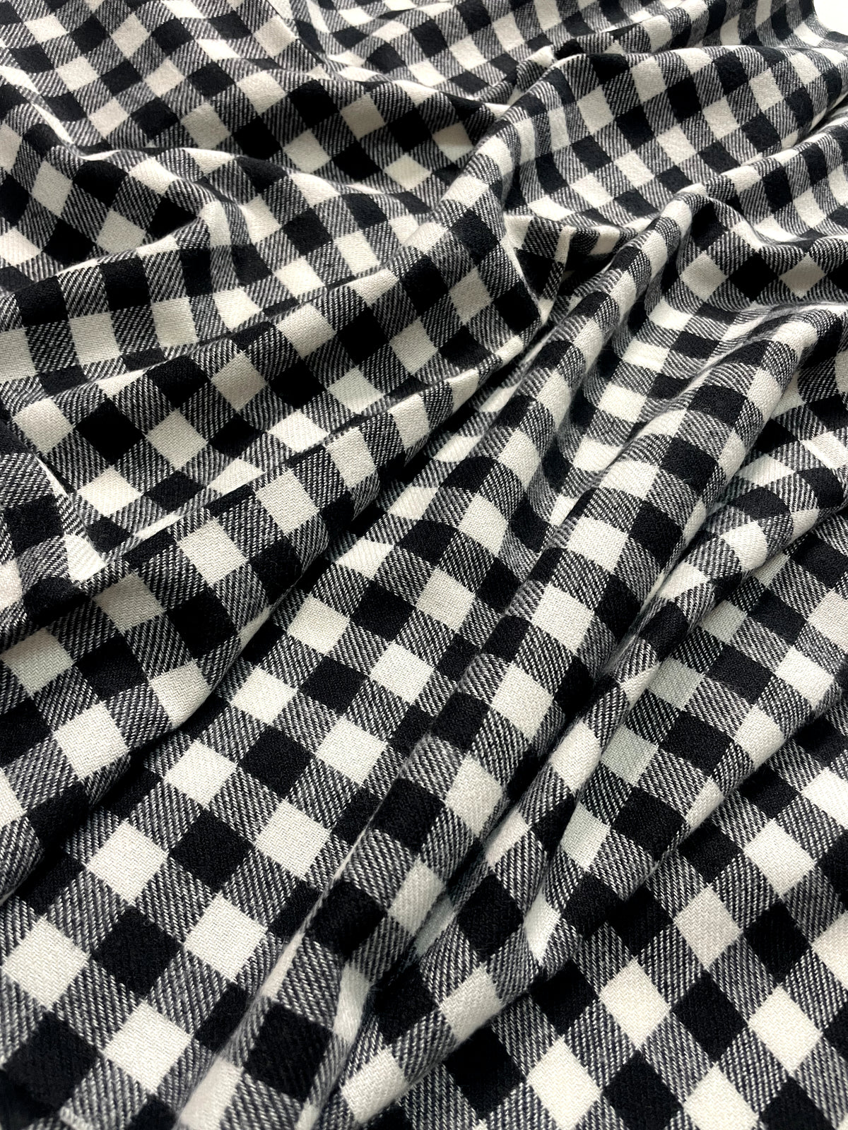 The Amritsar Store black and white check wool scarf with classic plaid pattern and soft winter weave