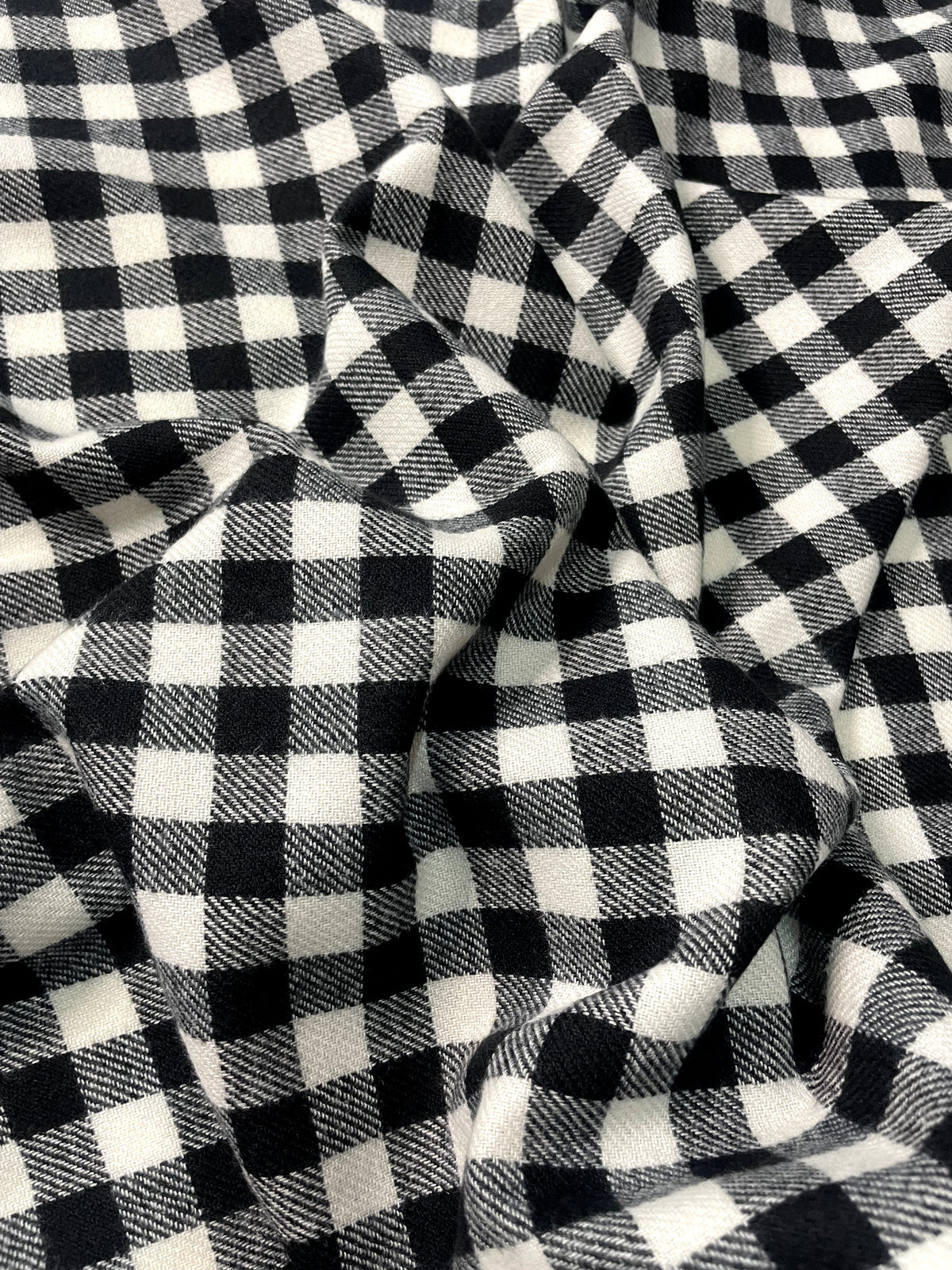 The Amritsar Store black and white check wool scarf with classic plaid pattern and soft winter weave