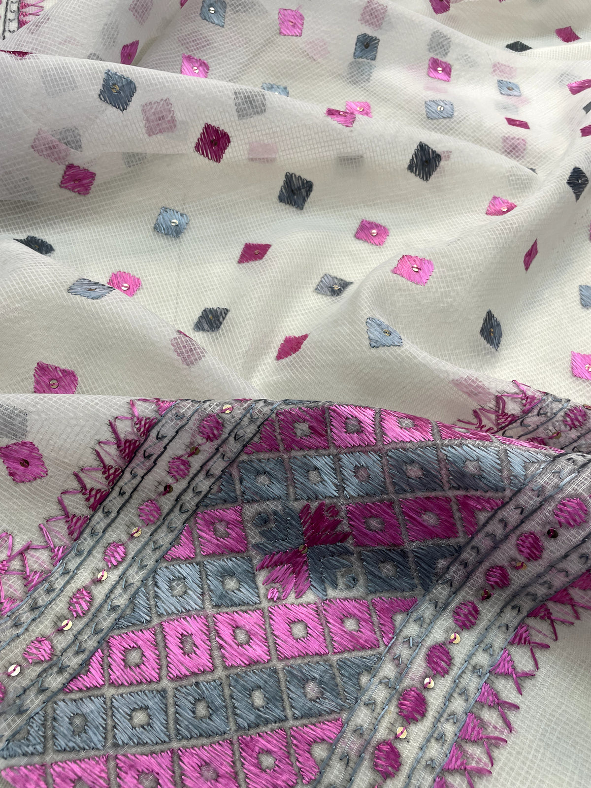 Hand embroidered white Phulkari dupatta with pink and grey Punjabi threadwork, traditional ethnic design and handcrafted detailing by The Amritsar Store