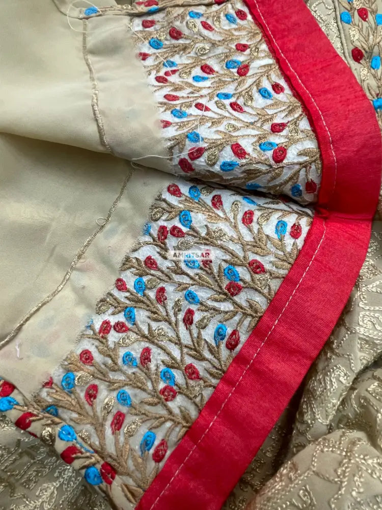 The Amritsar Store georgette kurti featuring elegant red and blue floral borders, lightweight ethnic wear for women, perfect for festive and casual occasions