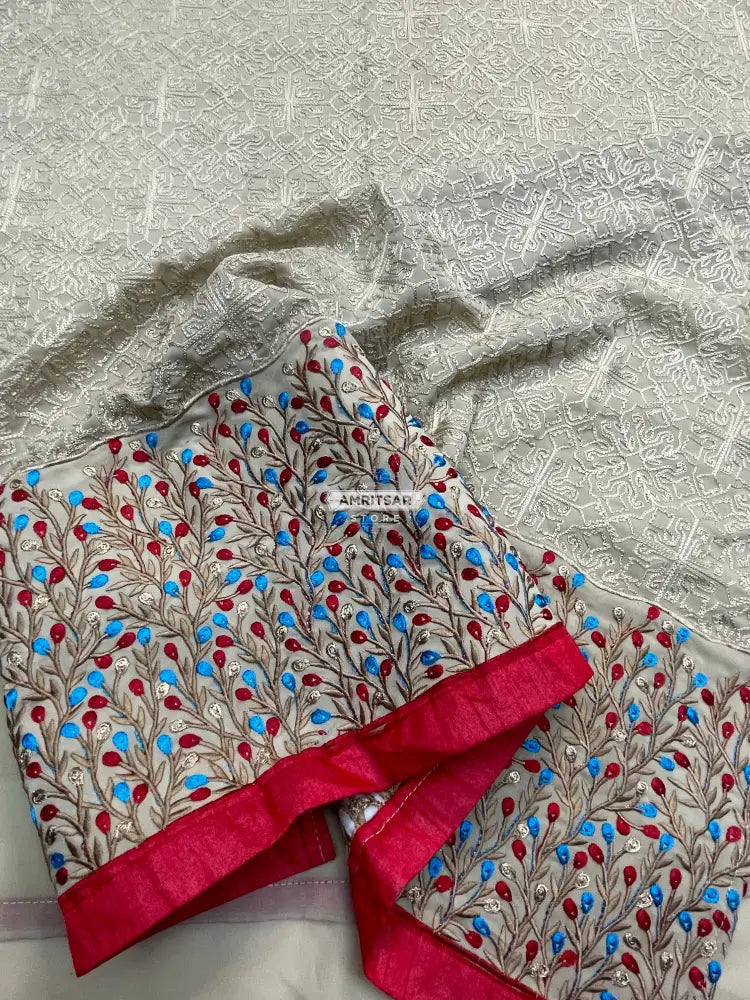 The Amritsar Store georgette kurti featuring elegant red and blue floral borders, lightweight ethnic wear for women, perfect for festive and casual occasions