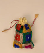 Traditional Punjabi multicolor Phulkari embroidered potli bag for women by The Amritsar Store.