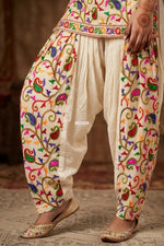 Off-white kora cotton salwar with traditional folk embroidery, lightweight breathable fabric, elegant Punjabi ethnic wear by The Amritsar Store