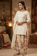 Off-white kora cotton salwar with traditional folk embroidery, lightweight breathable fabric, elegant Punjabi ethnic wear by The Amritsar Store
