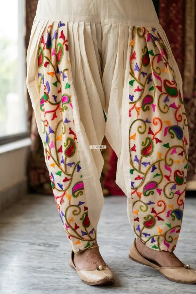 Off-white kora cotton salwar with traditional folk embroidery, lightweight breathable fabric, elegant Punjabi ethnic wear by The Amritsar Store