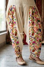 Off-white kora cotton salwar with traditional folk embroidery, lightweight breathable fabric, elegant Punjabi ethnic wear by The Amritsar Store