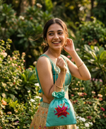 Handcrafted Phulkari Potli Bag by The Amritsar Store featuring vibrant Punjabi embroidery, perfect for weddings, festive occasions, and ethnic wear styling.