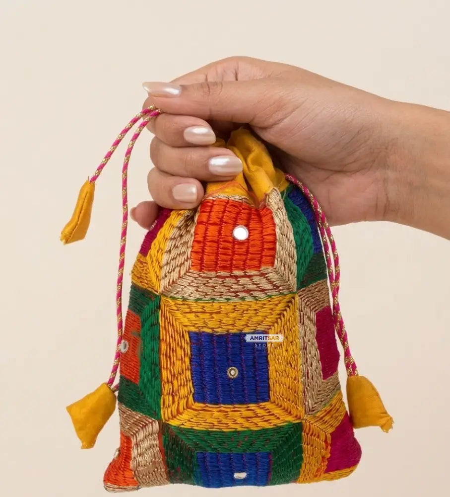 Traditional Punjabi multicolor Phulkari embroidered potli bag for women by The Amritsar Store.