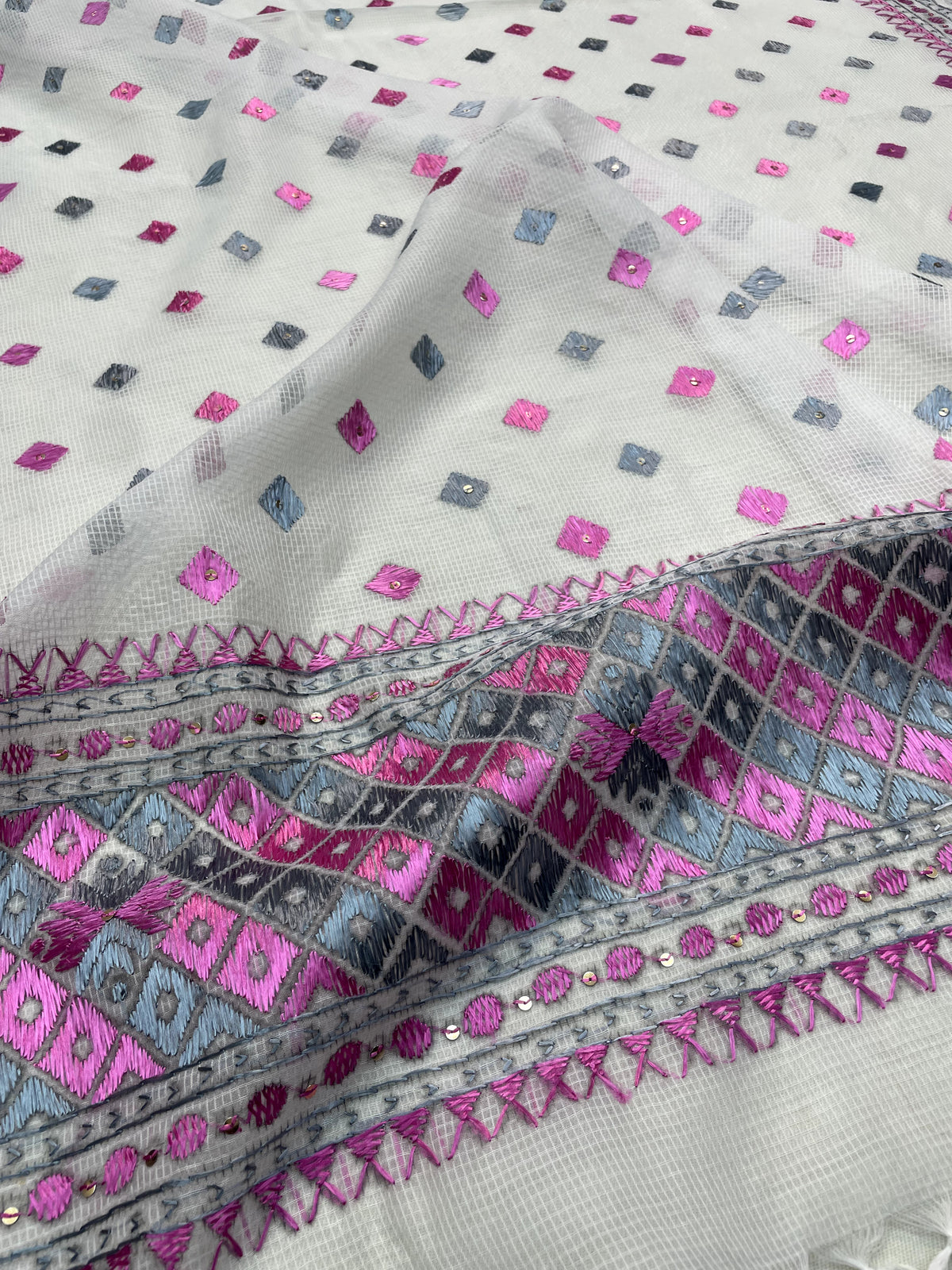 Hand embroidered white Phulkari dupatta with pink and grey Punjabi threadwork, traditional ethnic design and handcrafted detailing by The Amritsar Store