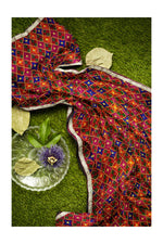Rangoli Charm Phulkarireflects the vibrant magenta base and multicolor embroidery, reminiscent of a traditional rangoli design, full of color and cultural richness.