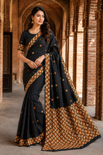 Hand embroidered black silk Phulkari saree with traditional Punjabi embroidery and geometric border design for women
