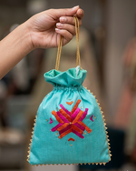 Handcrafted Phulkari Potli Bag by The Amritsar Store featuring vibrant Punjabi embroidery, perfect for weddings, festive occasions, and ethnic wear styling.
