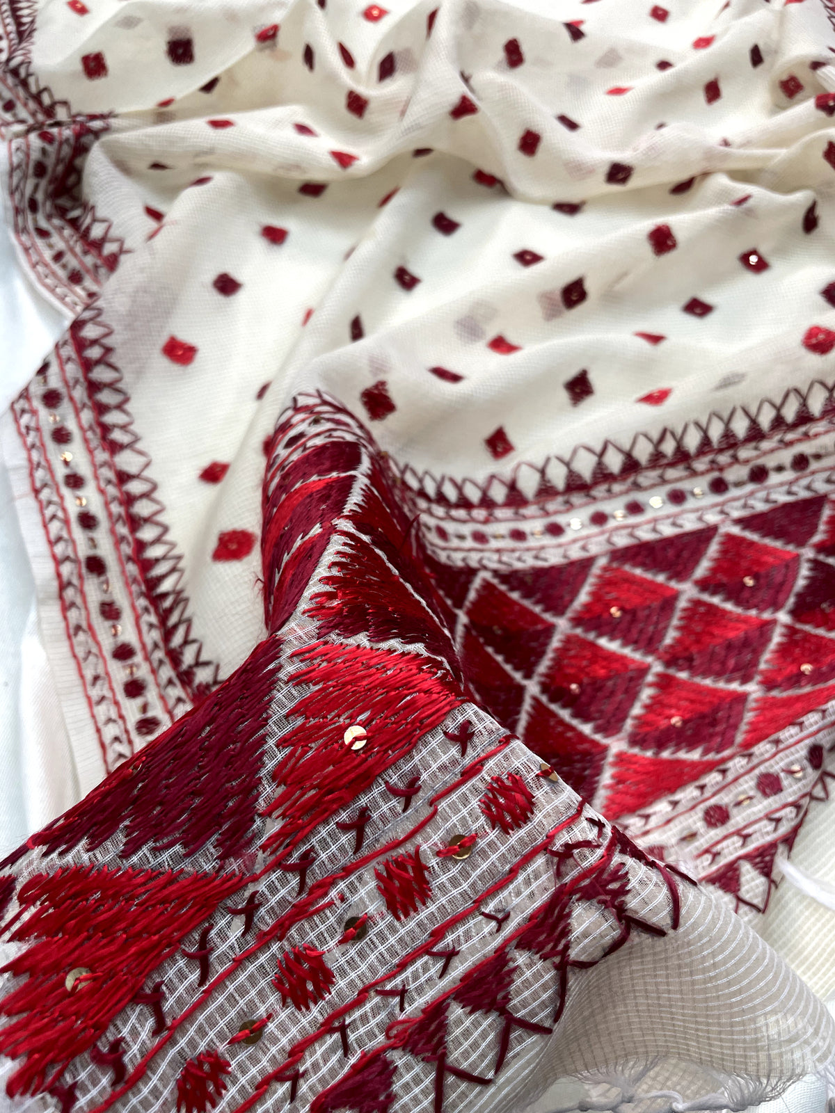 Hand embroidered off white Phulkari dupatta with red floral Punjabi embroidery by The Amritsar Store