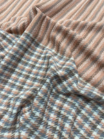 The Amritsar Store elegant reversible wool scarf featuring grey plaid design with soft pink woven accents