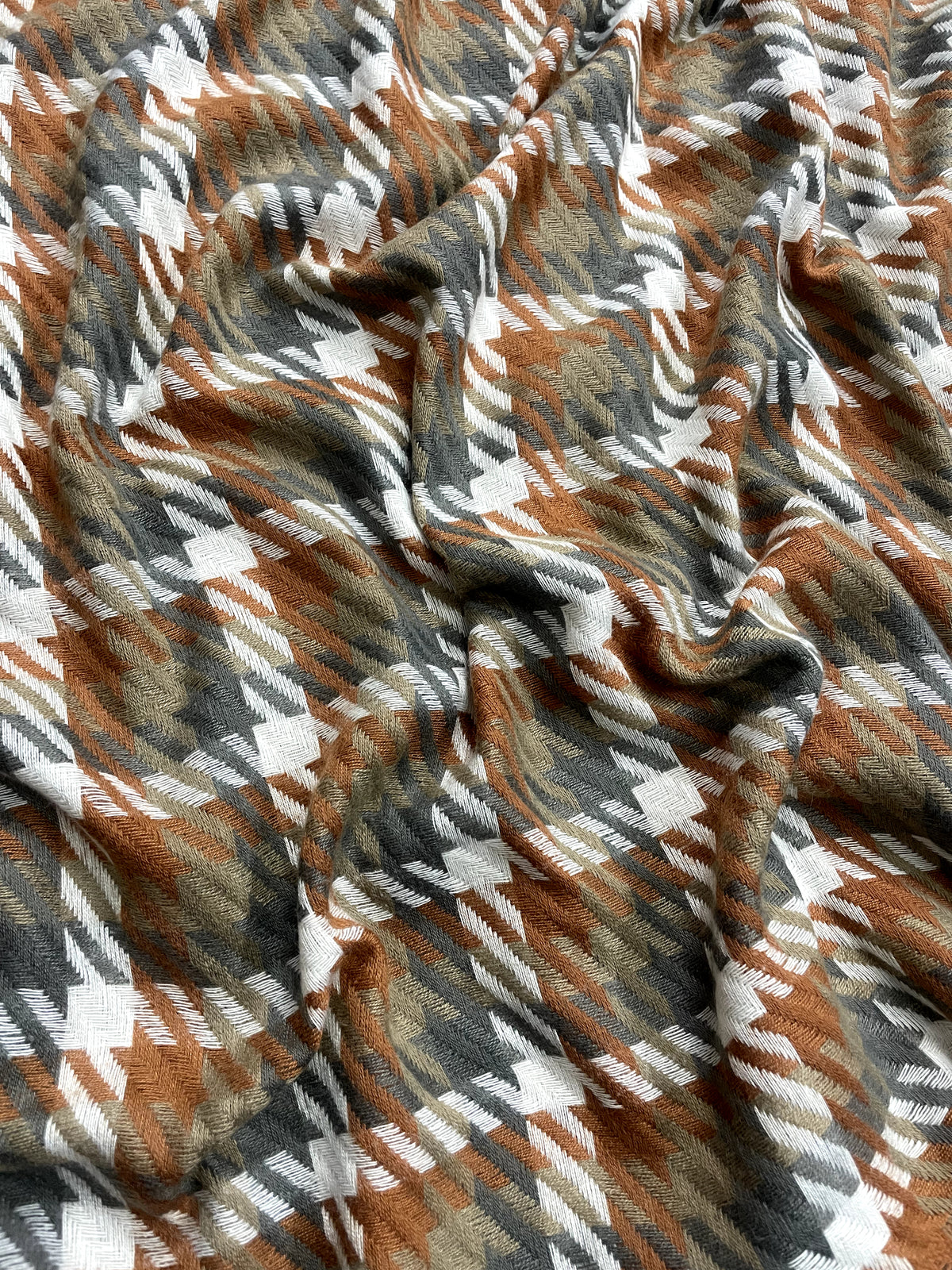 The Amritsar Store rust and olive classic check scarf for women, featuring an elegant checked pattern and soft drape