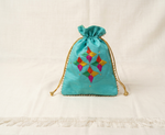 Handcrafted teal Phulkari embroidered potli bag with multicolor geometric floral design, golden lace border, and drawstring closure, traditional Punjabi ethnic accessory
