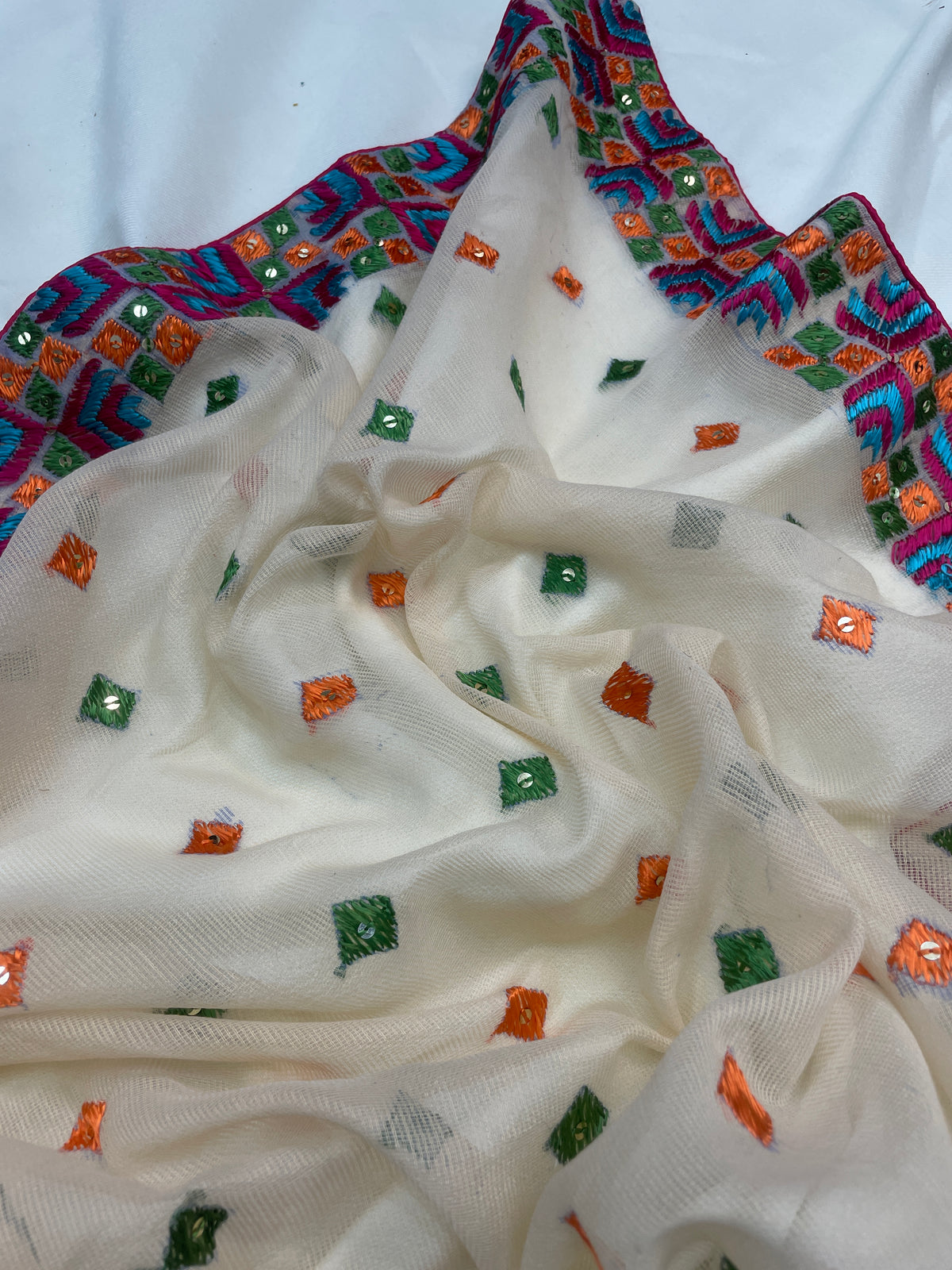 The Amritsar Store Phulkari Hand Embroidered Dupatta in cream color adorned with vibrant multicolor thread work, showcasing traditional Punjabi craftsmanship and elegance.