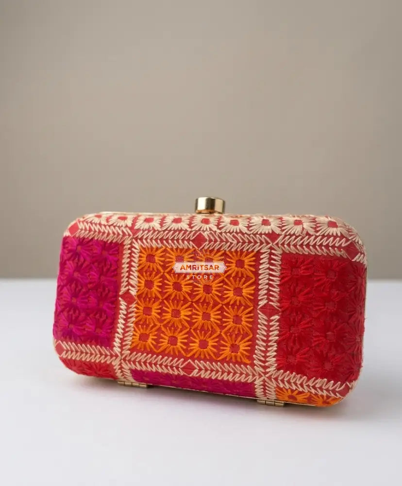 The Amritsar Store handmade red clutch bag with green floral embroidery, traditional ethnic handcrafted evening purse for women