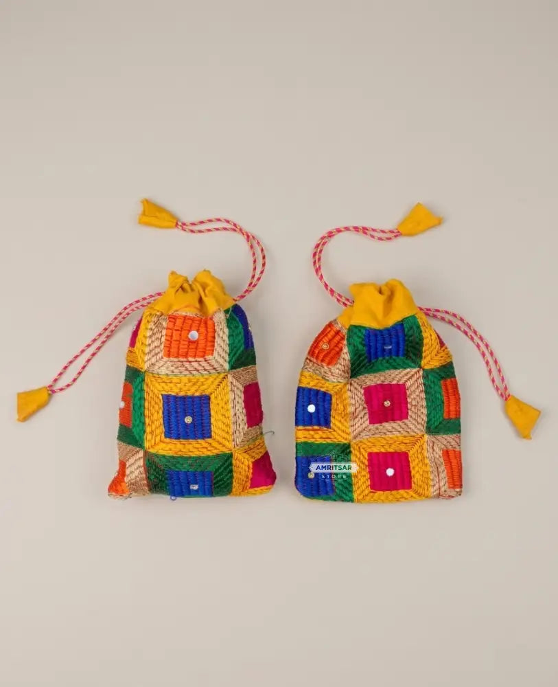 Traditional Punjabi multicolor Phulkari embroidered potli bag for women by The Amritsar Store.