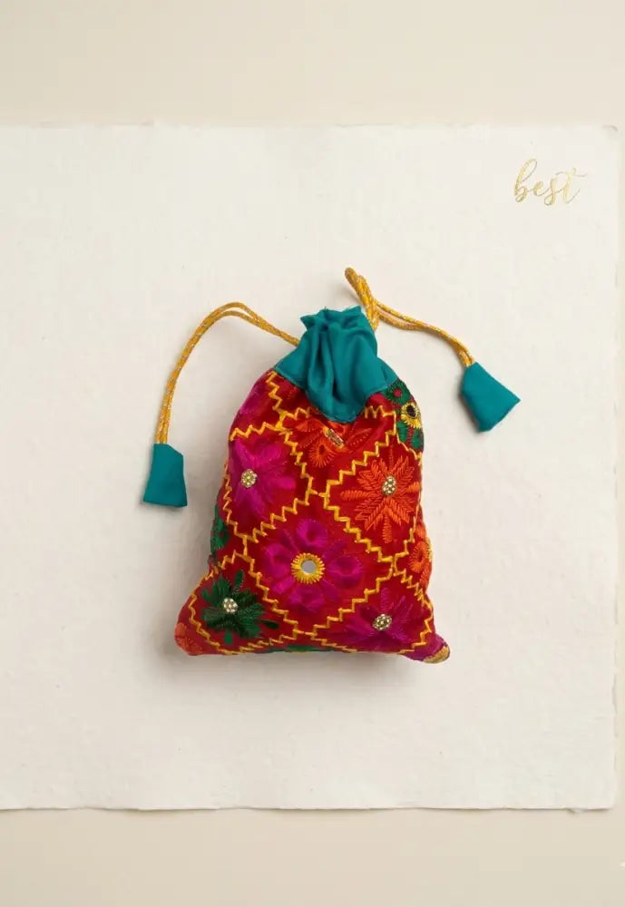 Traditional Punjabi multicolor Phulkari embroidered potli bag for women by The Amritsar Store.