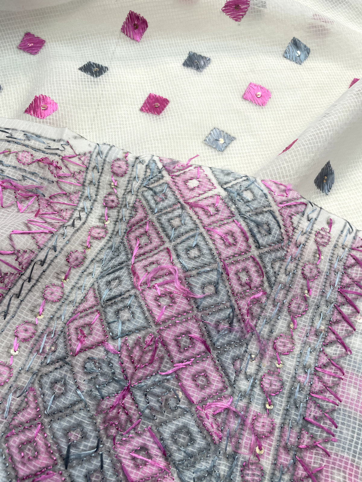 Hand embroidered white Phulkari dupatta with pink and grey Punjabi threadwork, traditional ethnic design and handcrafted detailing by The Amritsar Store
